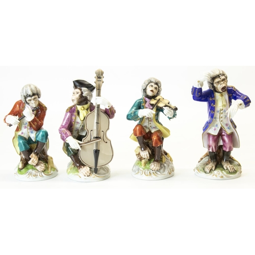 1085 - Set of four continental porcelain Meissen style monkey bandsmen, decorated in colours, on circular n... 