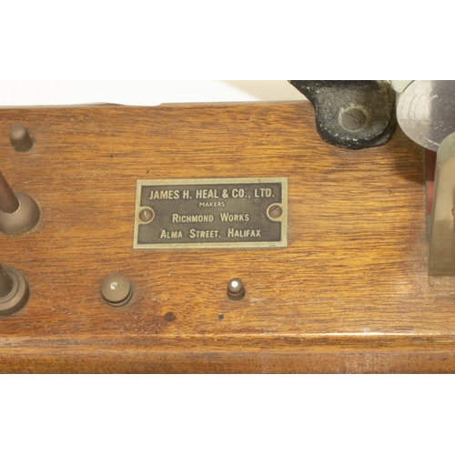 1220 - James Heal & Co. Halifax, a brass and cast iron yarn tester, on rectangular mahogany base, L65cm H39... 