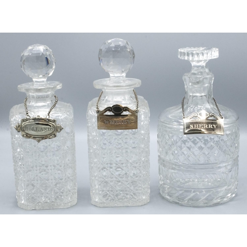 1106 - Two hobnail decorated lead crystal decanters, similar jug with prismatic stoppers, with EPNS labels ... 