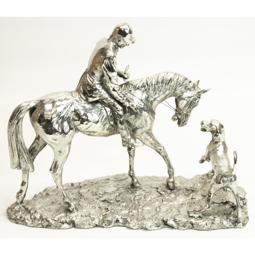 1135 - Silvered Hunting group modelled as a mounted huntsman with hound, on a naturalistic base, W33cm H26c... 