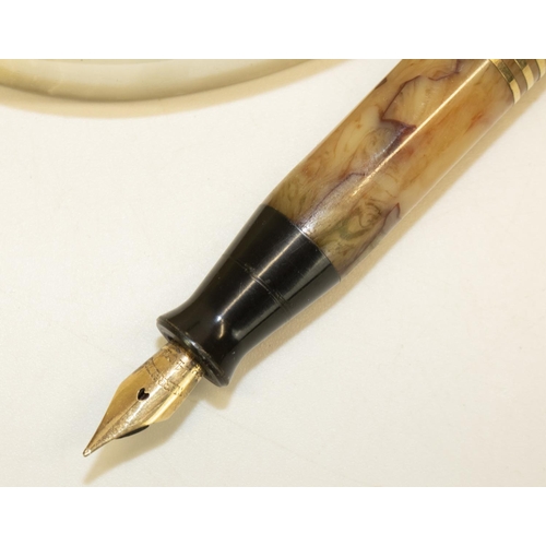 1229 - Waterman Ideal type fountain pen, marbled body with three gold stripes and 14ct gold nib, on oval on... 