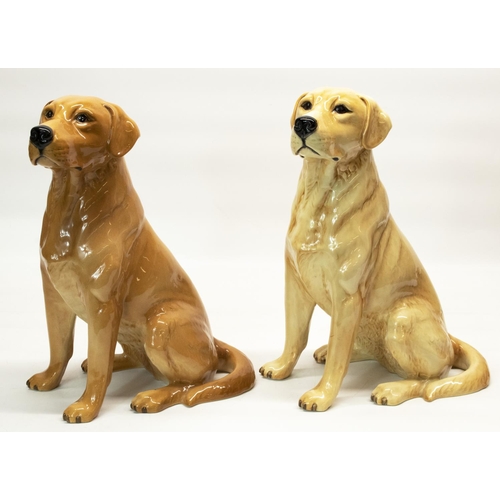 1091 - Two large Beswick fire side models of seated yellow and red Labradors, both No. 2314, impressed and ... 