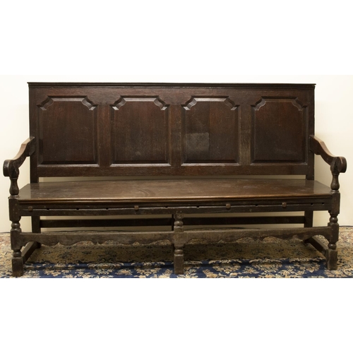 1370 - C18th and later oak settle, raised back with moulded top rail above four fielded panels, solid seat ... 