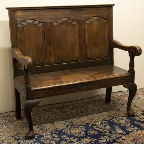 1373 - Small stained as oak pine settle, raised back with moulded top rail above three fielded panels, soli... 