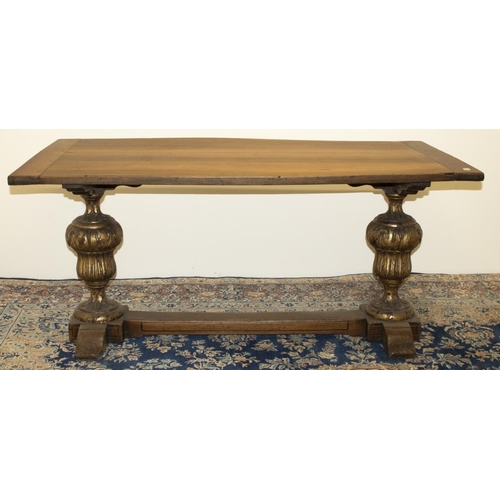 1365 - Refectory style dining table, cleated planked sycamore top on gilt carved urn shaped oak end support... 