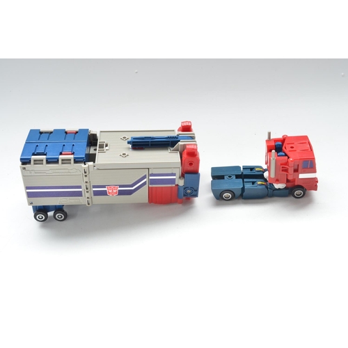 25 - Boxed Hasbro Optimus Prime Transformer, excellent little used condition, box fair (torn end flap) an... 