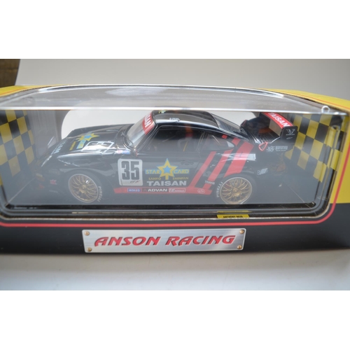 34 - Two 1/18 diecast racing Porsche 911 GT2 models from Anson Models, Taisan 35 and American Signature 0... 
