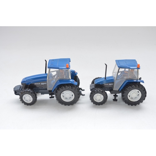 60 - Three boxed 1/32 scale Britain's tractor models to include New Holland 8560 (item no 9488), New Holl... 