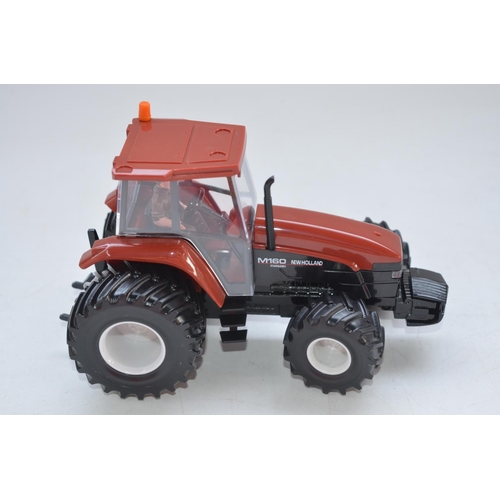 60 - Three boxed 1/32 scale Britain's tractor models to include New Holland 8560 (item no 9488), New Holl... 