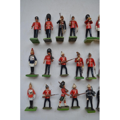 77 - Collection of mostly modern W.Britain's cast metal soldier figures, incl. Highlanders, bandsmen, Bee... 