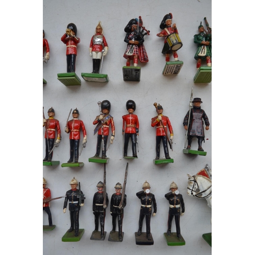 77 - Collection of mostly modern W.Britain's cast metal soldier figures, incl. Highlanders, bandsmen, Bee... 