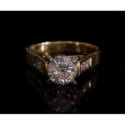 1006 - 18ct yellow gold diamond solitaire ring, the round cut diamond in a white gold Tiffany style setting... 