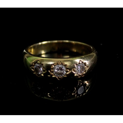 1019 - 18ct yellow gold three stone gypsy ring set with three brilliant cut diamonds, stamped 750, size P, ... 