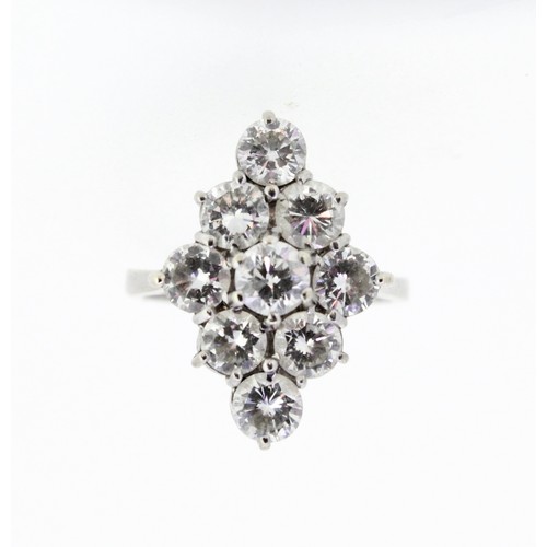 1007 - 18ct white gold diamond cluster ring, the nine brilliant cut diamonds in claw settings on plain shan... 