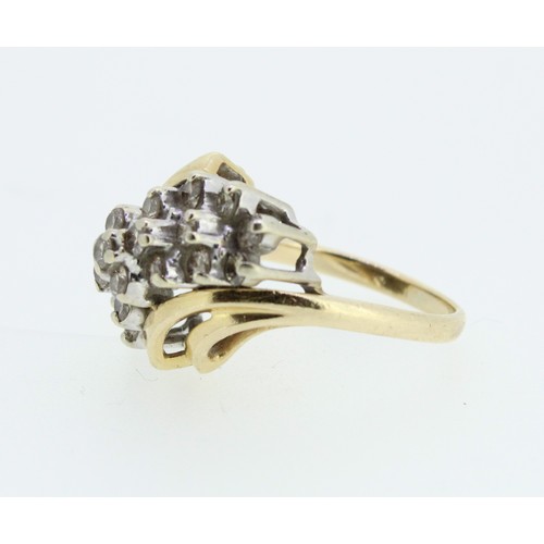 1034 - 14ct yellow gold cocktail ring set with twenty one brilliant cut diamonds, on twist shoulders and pl... 