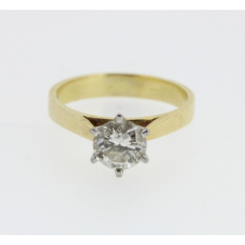 1008 - 18ct yellow gold diamond solitaire ring, the round cut diamond in a white gold Tiffany style setting... 