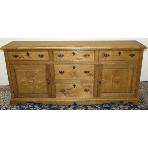 1383 - Stewart Linford Furniture - an oak low dresser, moulded top above five drawers and two fielded panel... 