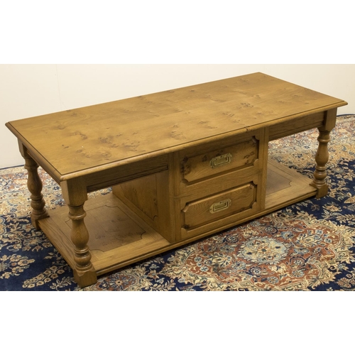 1384 - Stewart Linford Furniture - an oak two tier rectangular coffee table, moulded burr top above two dra... 