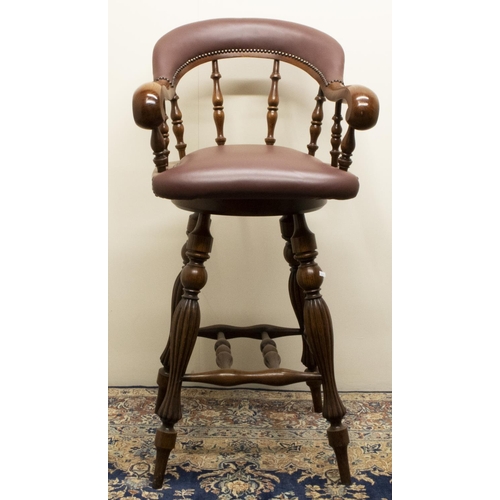 1387 - Stewart Linford Furniture - a Captains chair bar stool, brass nail upholstered back and seat on turn... 