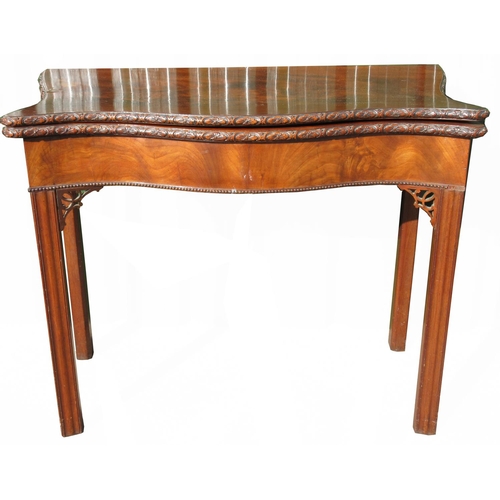 1378 - George III serpentine mahogany folding tea table with rosette carved edge, single gate action on squ... 