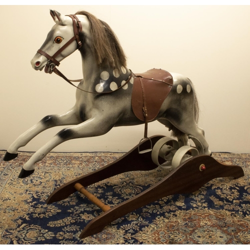 1390 - Ragamuffin Toys Ltd. of Guernsey - a fibreglass rocking horse, painted dappled with real horse hair ... 