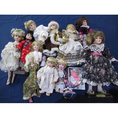 194 - Large collection of modern porcelain collector's dolls in various outfits