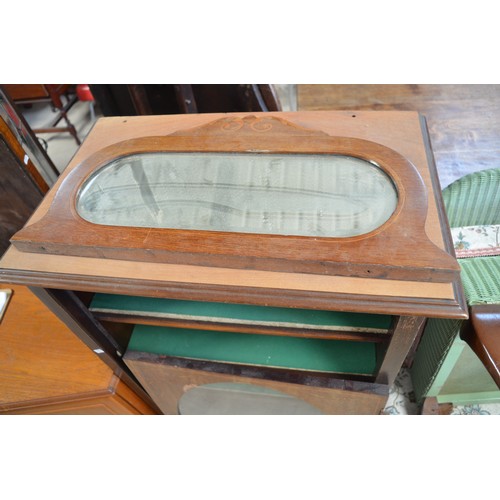 224 - Edwardian mahogany music cabinet, with mirrored galleried back and oval glazed door on square suppor... 