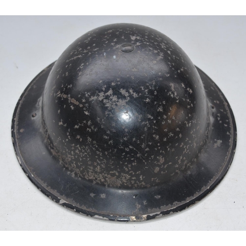 710 - WW2 era black painted helmet