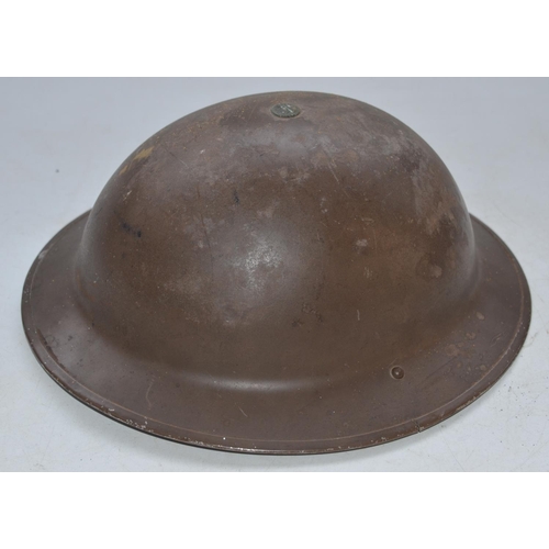 712 - WW2 era British steel helmet with chinstrap, stamped F&L 1/1939