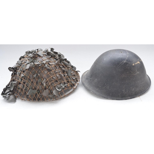 721 - Two British Army MkIV Turtle helmets with liners, one dated 1955, the other no visible markings