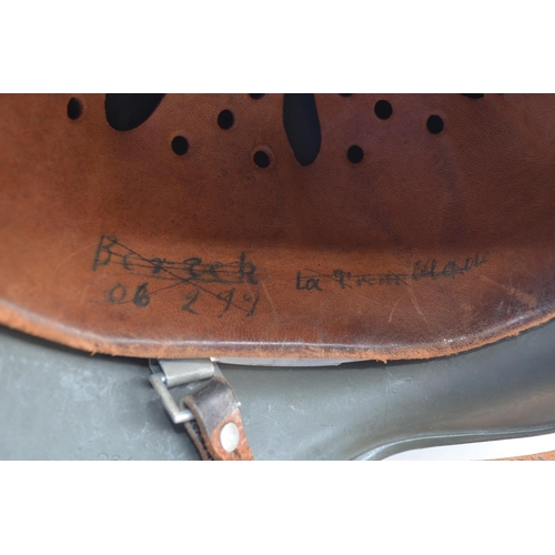 723 - WW2 German helmet with leather liner and chinstrap. Stamped 995 with users names written on liner. P... 