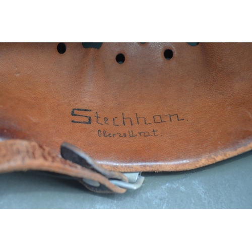 723 - WW2 German helmet with leather liner and chinstrap. Stamped 995 with users names written on liner. P... 