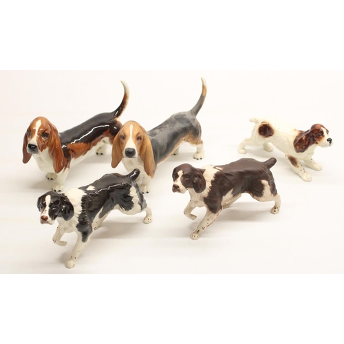 172 - Two Beswick Springer Spaniels, model #3135, another Beswick Springer Spaniel, and two Beswick basset... 