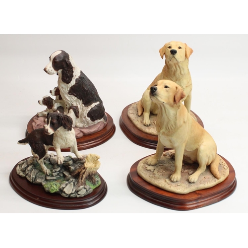 180 - Margaret Turner Border Fine Arts models: two seated Labradors, H25cm, spaniel and pups, H20cm, and a... 