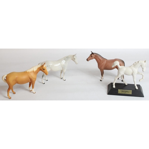 235 - Three small Beswick Horses and Springtime foal on plinth