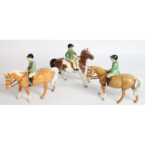 239 - Beswick Boy on Palomino Pony model 1500 (2) and a Girl on Skewbald Pony model 1499