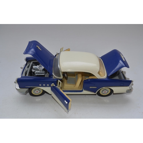 424 - Three friction powered 1/18 scale tinplate classic American cars including a boxed Standard Sedan mo... 