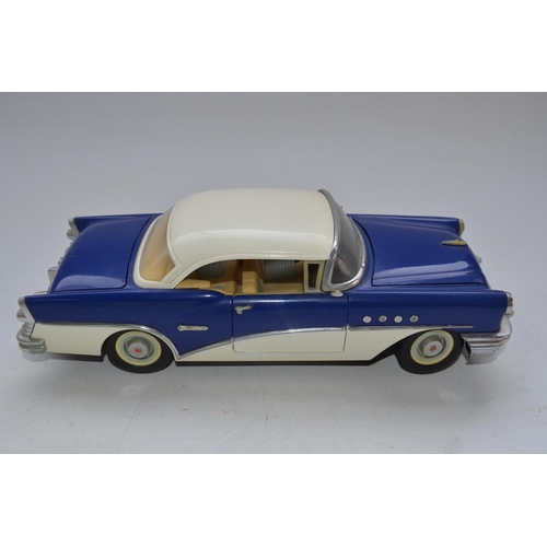 424 - Three friction powered 1/18 scale tinplate classic American cars including a boxed Standard Sedan mo... 