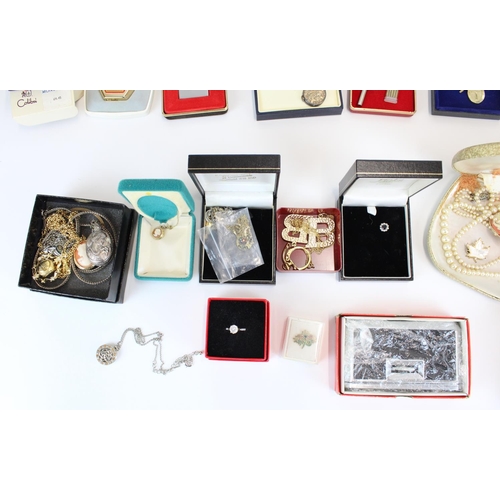 44 - Collection of costume jewellery pendants, brooches, simulated pearls etc. together with lighters and... 
