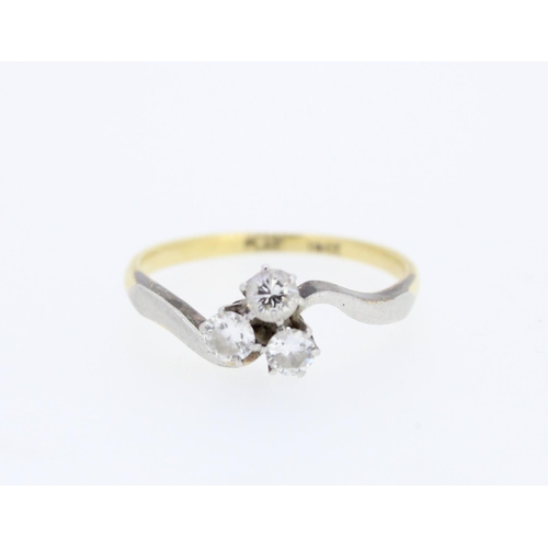 54 - 18ct gold three stone diamond ring, the three brilliant cut diamonds claw set on scrolled platinum s... 