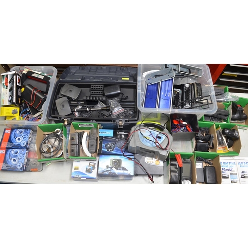 557 - Collection of automotive accessories including CD/radios, lights and light fittings, battery charger... 