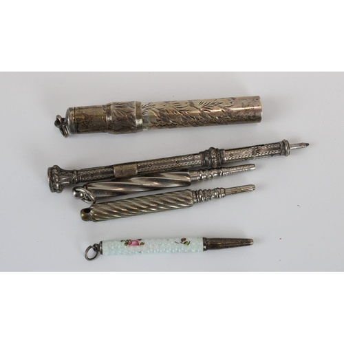 62 - Five early C20th white metal propelling pencils, two Parker ballpoints, Italian glass cheroot holder... 