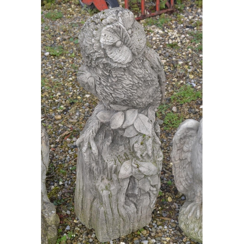 529 - Eight reconstituted stone owl garden ornaments