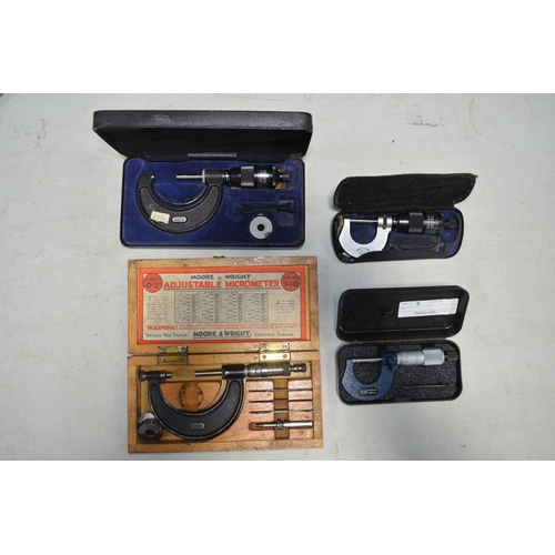 535 - Four Moore And Wright micrometers, all with original cases, a small set of calipers by King Dick, a ... 