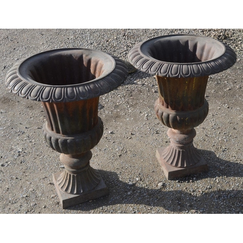 84 - Pair of Regency style cast iron urns on square tapering pedestals H71 x W54cm (2)