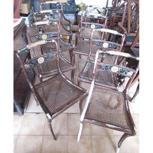 505 - Set of eight Regency style dining chairs, later painted as parcel gilt rosewood, with canework seats... 