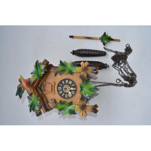 100 - Cuckoo clock from Freudenstadt, Black Forest area of Germany, built circa 1980 with cast metal pinec... 