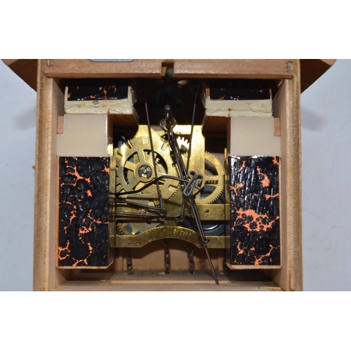 100 - Cuckoo clock from Freudenstadt, Black Forest area of Germany, built circa 1980 with cast metal pinec... 