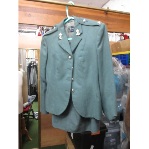 819 - Ladies green military jackets with skirts and three green ladies military style skirts