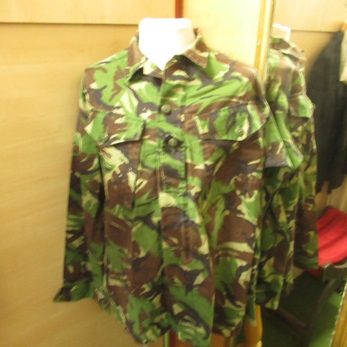 128 - Seven green camouflage shirts and five brown & beige camouflage jackets, various sizes (12 in 1 box)